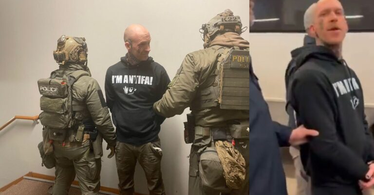 Law enforcement officers outside an apartment building during a predawn operation