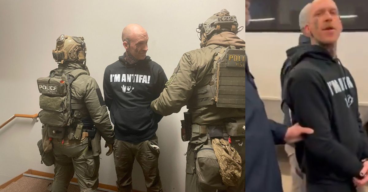 Law enforcement officers outside an apartment building during a predawn operation