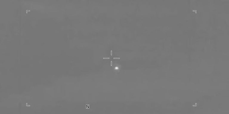 Military video reportedly shows small objects crossing a desert sky