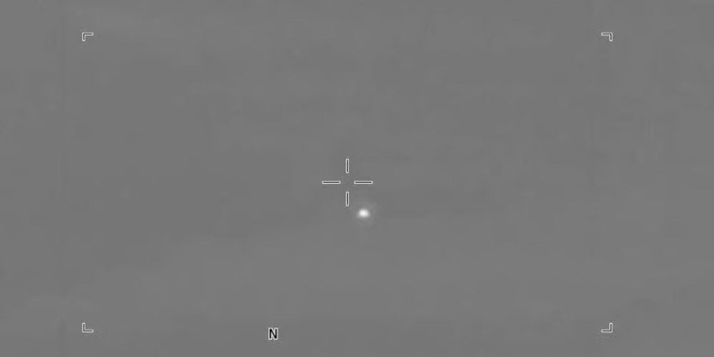 Military video reportedly shows small objects crossing a desert sky